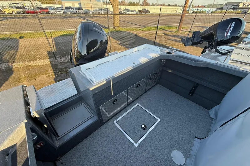 Slide: The Image of 2026 Thunder Jet 185 Luxor boat interior with storage compartments and Mercury engine. - 36