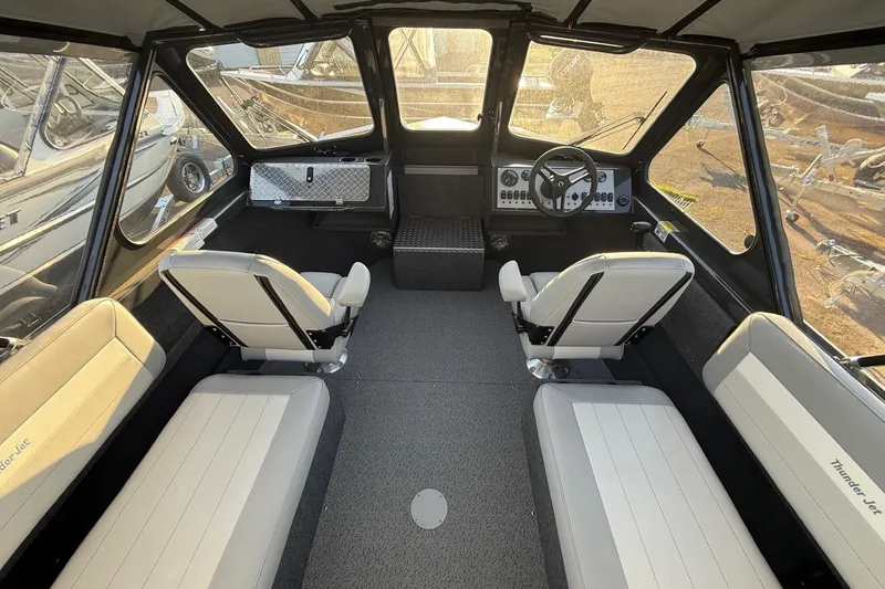 Slide: The Image of 2026 Thunder Jet 185 Luxor boat interior with seating and steering console. - 39