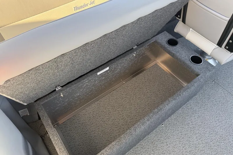 Slide: The Image of 2026 Thunder Jet 185 Luxor boat interior storage compartment with cup holders. - 42