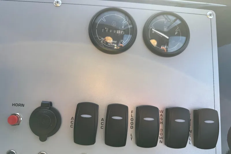 Slide: The Image of Control panel of 2026 Thunder Jet 185 Luxor boat with gauges and switches. - 48
