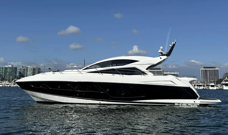 The Image of 2015 Sunseeker Predator 57 yacht on water, sleek design, clear sky background. - 1