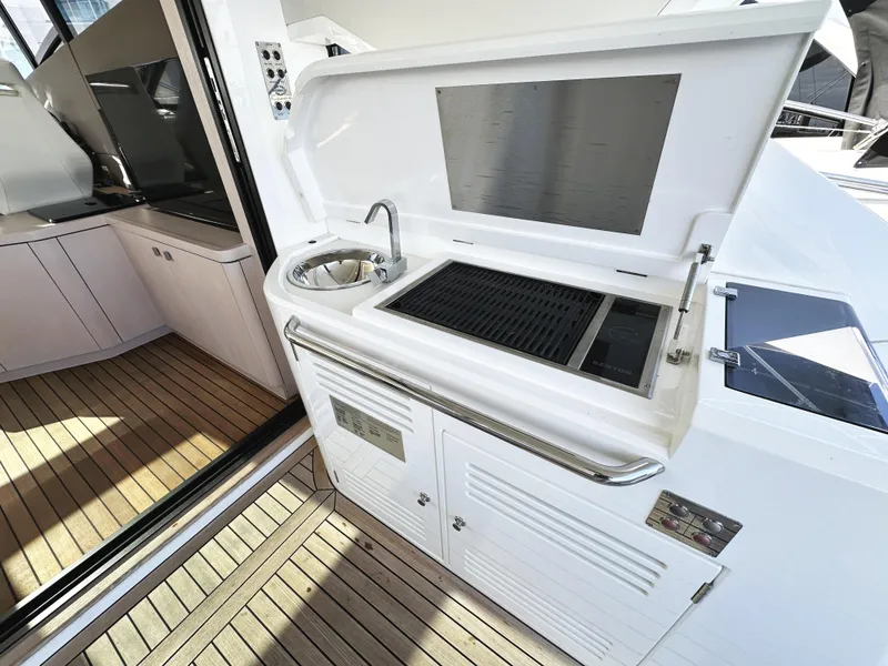 Slide: The Image of Outdoor kitchen on 2015 Sunseeker Predator 57 yacht with sink and grill. - 13