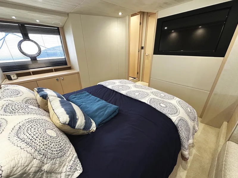 Slide: The Image of Luxurious bedroom interior of 2015 Sunseeker Predator 57 yacht with modern decor and large TV. - 41