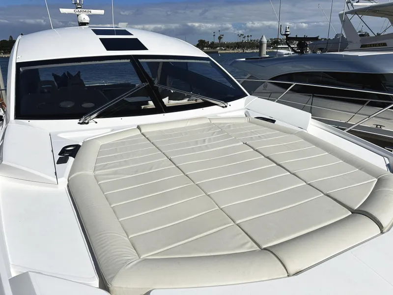 Slide: The Image of 2015 Sunseeker Predator 57 yacht with spacious sunbathing deck, docked at marina. - 44