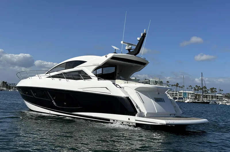 Slide: The Image of 2015 Sunseeker Predator 57 yacht on water, clear sky background. - 7