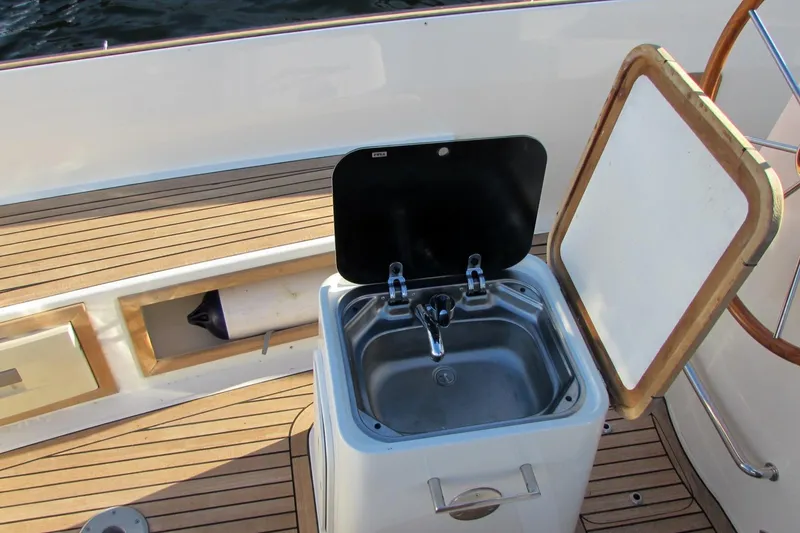 Slide: The Image of Outdoor sink on 2014 AdmiralsTender C28 boat with teak deck. - 8