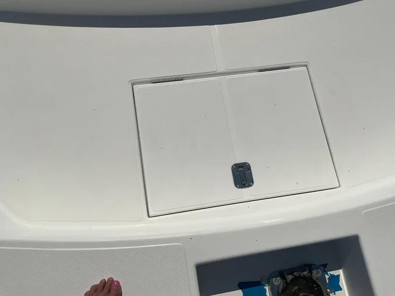 Slide: The Image of 2002 West Bay Sonship boat deck with hatch and visible foot. - 29