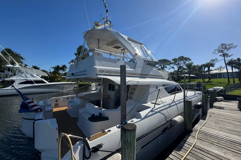 Slide: The Image of 2007 Africat Marine 420 yacht docked under clear blue sky. - 101