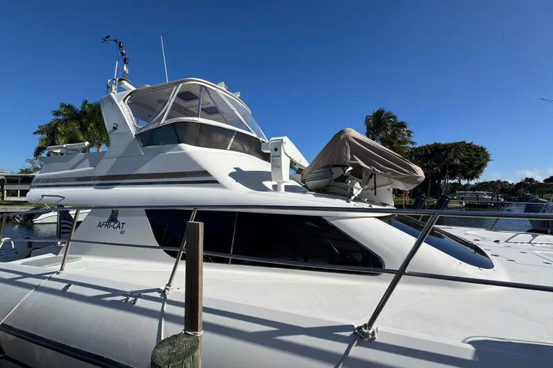 Slide: The Image of 2007 Africat Marine 420 yacht docked under clear blue sky. - 105