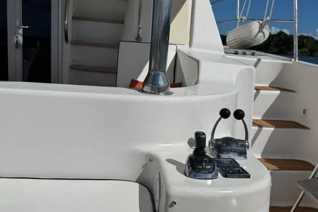 Slide: The Image of Control panel on 2007 Africat Marine 420 yacht, featuring dual levers and joystick. - 13