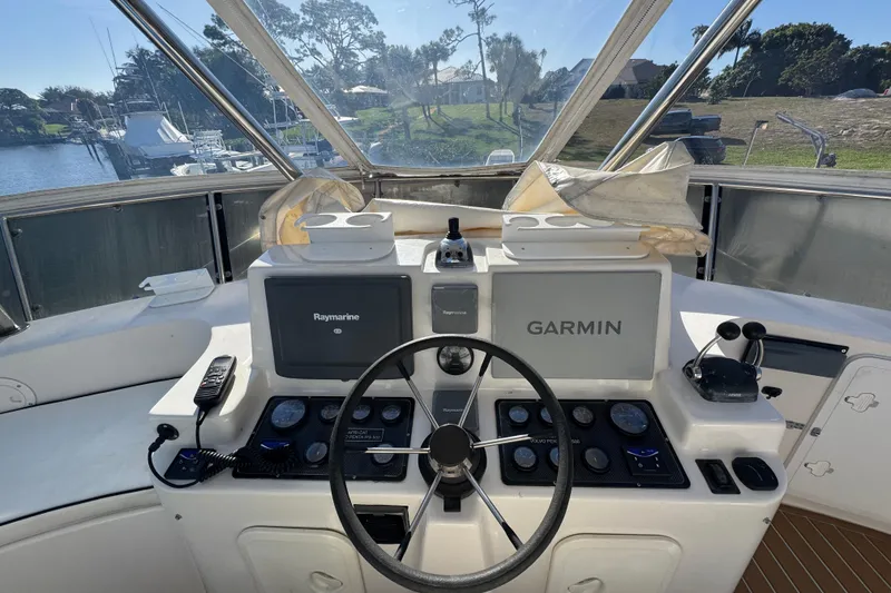Slide: The Image of Helm of 2007 Africat Marine 420 with Garmin and Raymarine navigation systems. - 15