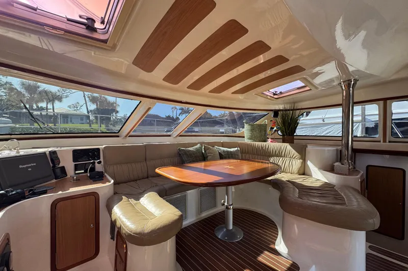 Slide: The Image of Luxurious interior of 2007 Africat Marine 420 yacht with plush seating and elegant wood finishes. - 20