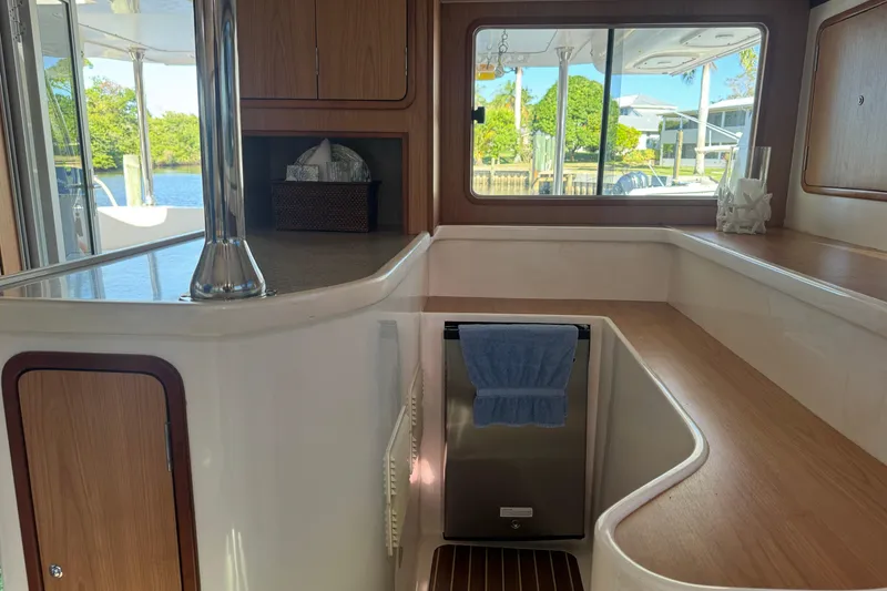 Slide: The Image of Interior of 2007 Africat Marine 420 yacht with wooden cabinetry and scenic window view. - 26