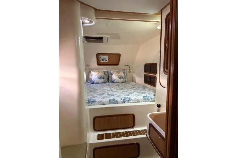 Slide: The Image of Cozy cabin interior of 2007 Africat Marine 420 with bed and wooden accents. - 31
