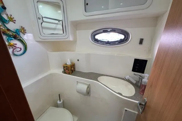 Slide: The Image of Compact bathroom in 2007 Africat Marine 420 yacht with sink, toilet, and decorative elements. - 33
