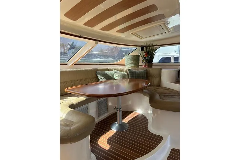Slide: The Image of Luxurious interior of 2007 Africat Marine 420 yacht with elegant seating and wooden table. - 38