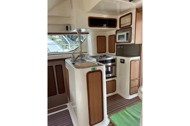 Slide: The Image of 2007 Africat Marine 420 yacht interior with modern kitchen and wooden cabinetry. - 39