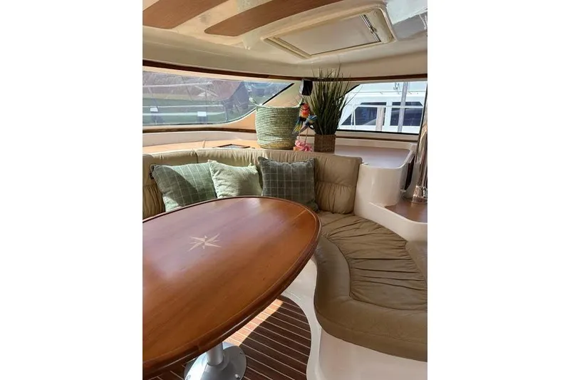 Slide: The Image of Luxurious interior of 2007 Africat Marine 420 yacht with elegant seating and wooden table. - 41