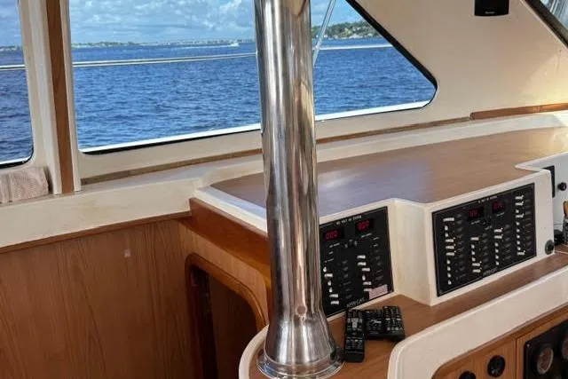 Slide: The Image of Interior of 2007 Africat Marine 420 yacht with control panels and ocean view. - 43