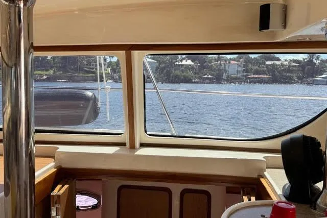 Slide: The Image of Interior view from a 2007 Africat Marine 420 yacht, overlooking a serene waterfront. - 46