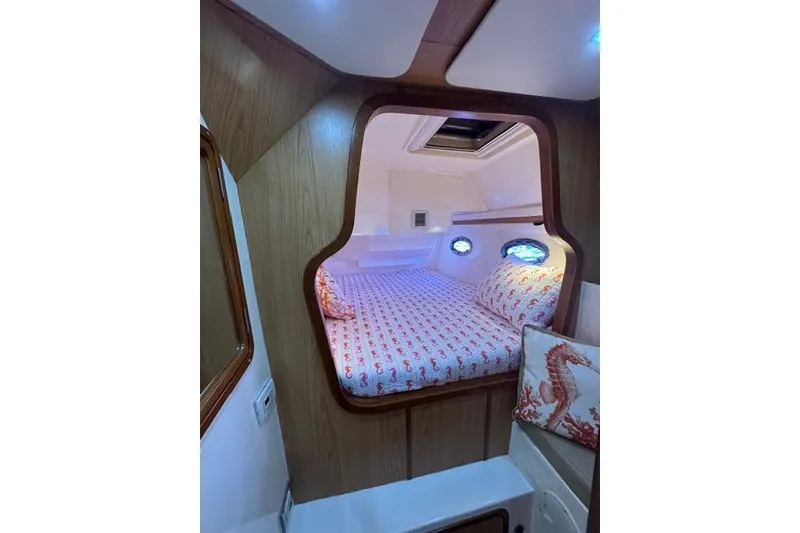 Slide: The Image of Cozy cabin interior of 2007 Africat Marine 420 with seahorse-themed bedding. - 49