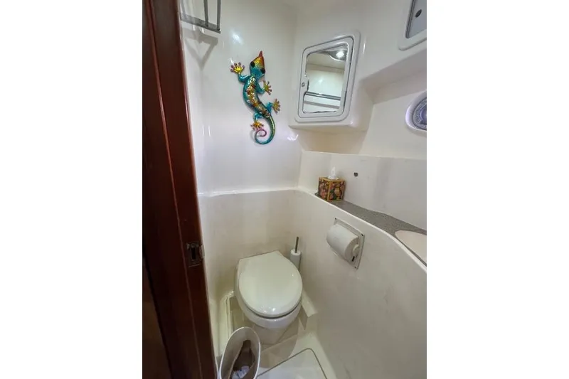 Slide: The Image of Compact bathroom in 2007 Africat Marine 420 yacht with colorful gecko wall decor. - 57