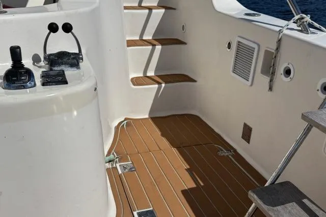 Slide: The Image of 2007 Africat Marine 420 yacht interior with wooden steps and control panel. - 60