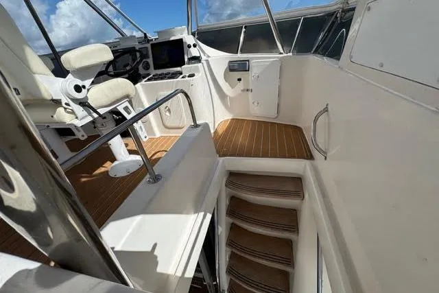 Slide: The Image of 2007 Africat Marine 420 yacht interior with helm station and wooden steps. - 64