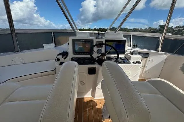Slide: The Image of Cockpit of 2007 Africat Marine 420 yacht with navigation equipment and dual seats. - 67