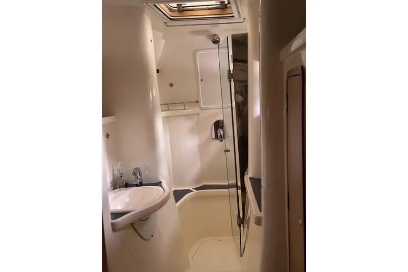Slide: The Image of Luxurious bathroom interior of 2007 Africat Marine 420 yacht, featuring modern fixtures and skylight. - 70