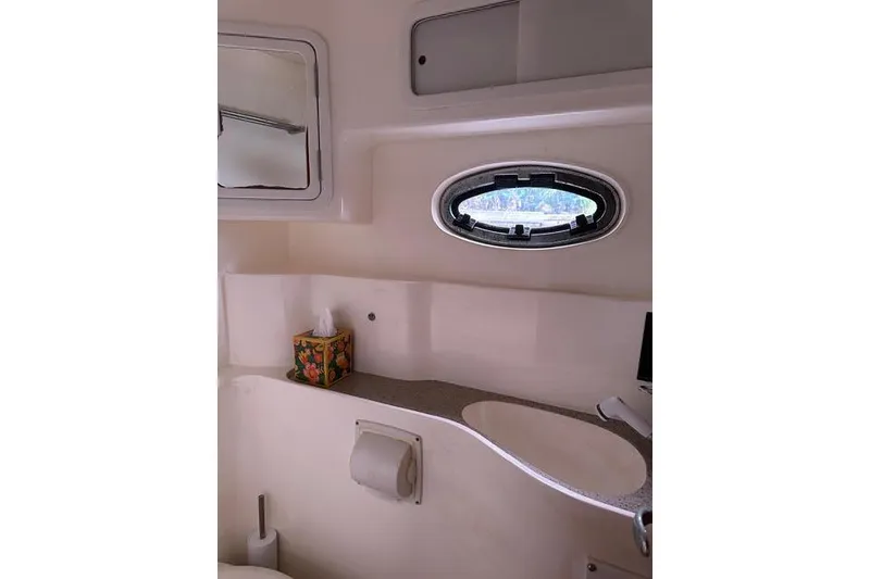 Slide: The Image of 2007 Africat Marine 420 yacht bathroom interior with porthole and sink. - 71