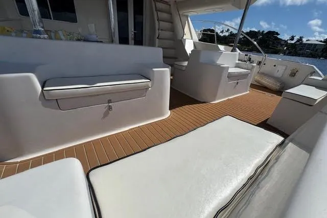 Slide: The Image of Luxurious 2007 Africat Marine 420 yacht interior with white seating and wooden flooring. - 8
