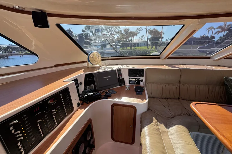Slide: The Image of Luxurious interior of 2007 Africat Marine 420 yacht with navigation equipment and plush seating. - 89