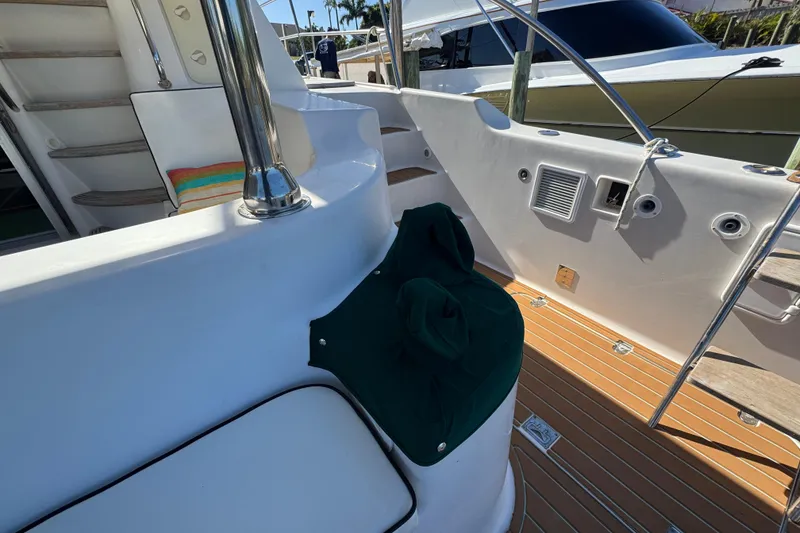 Slide: The Image of 2007 Africat Marine 420 yacht deck with seating and stairs, featuring sleek design elements. - 96