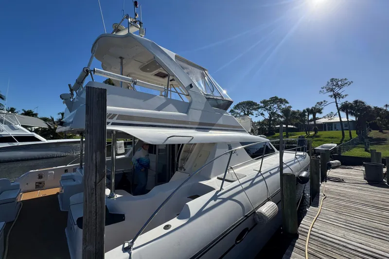 Slide: The Image of 2007 Africat Marine 420 yacht docked under clear blue sky. - 98