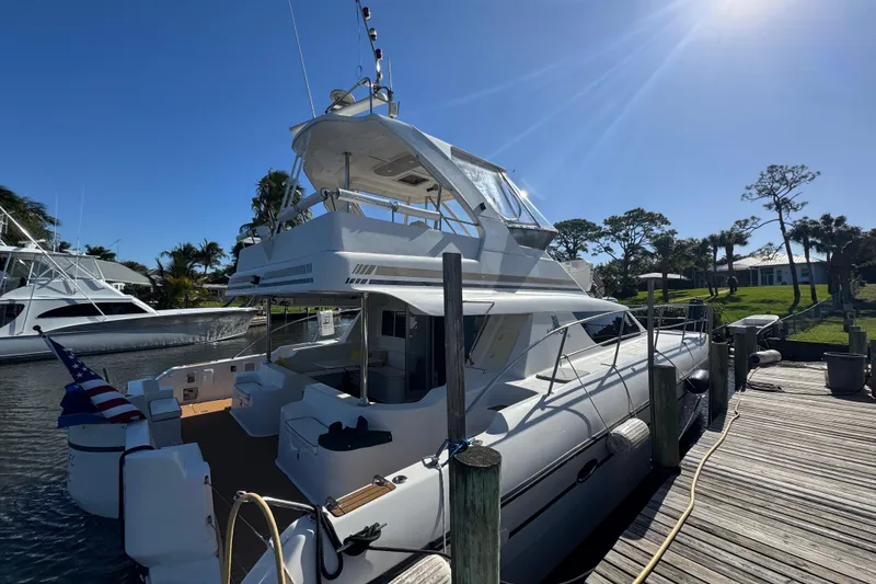 Slide: The Image of 2007 Africat Marine 420 yacht docked under clear blue sky. - 99