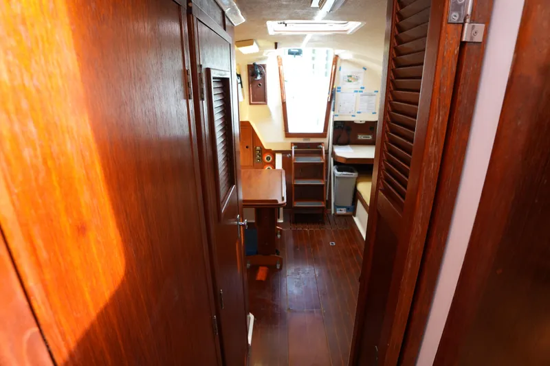 Slide: The Image of Interior of 1988 Nonsuch 30 Ultra sailboat with wooden finishes and compact design. - 23