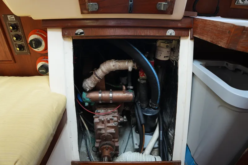 Slide: The Image of 1988 Nonsuch 30 Ultra engine compartment with visible components and wiring. - 24