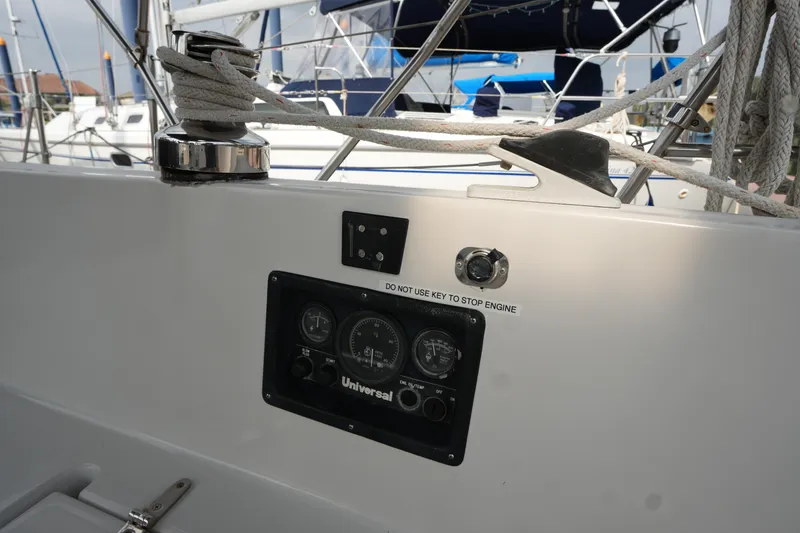 Slide: The Image of 1988 Nonsuch 30 Ultra sailboat cockpit with engine control panel and rigging. - 9