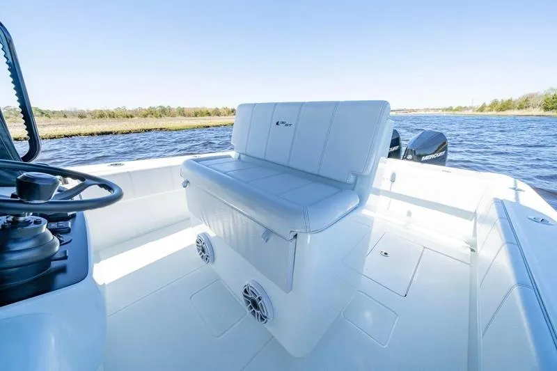 Slide: The Image of 2022 Contender 32 ST boat interior with white seating and water view. - 18