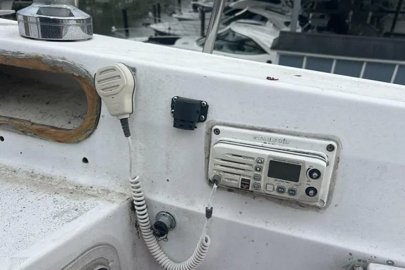 Slide: The Image of VHF radio and microphone on a 1985 Catalina 36 sailboat deck. - 13