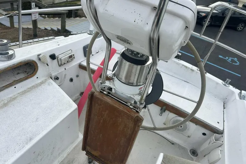 Slide: The Image of Cockpit of 1985 Catalina 36 sailboat with steering wheel and navigation instruments. - 15