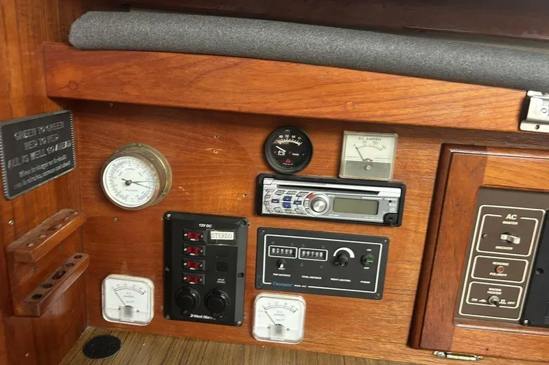 Slide: The Image of Control panel of a 1985 Catalina 36 sailboat with gauges and stereo system. - 29