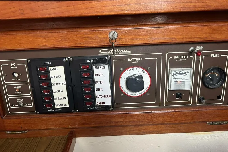 Slide: The Image of Control panel of a 1985 Catalina 36 yacht with battery and fuel gauges. - 30