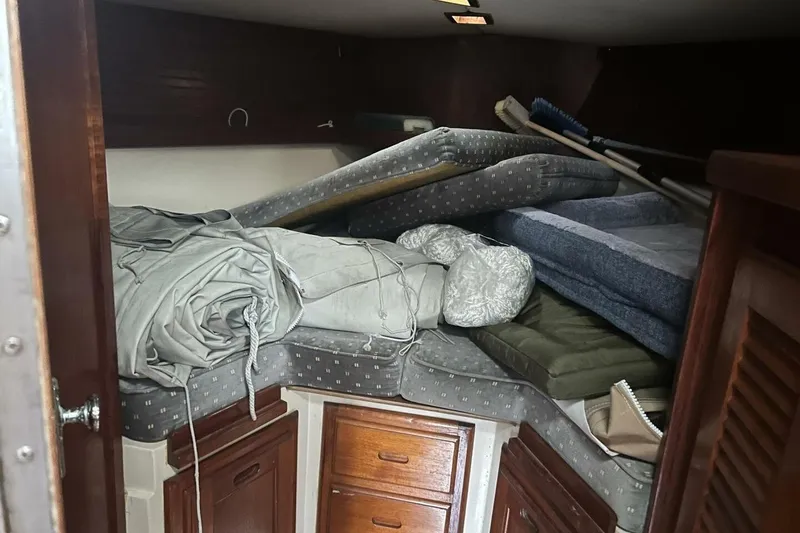 Slide: The Image of Interior cabin of 1985 Catalina 36 sailboat with cushions and storage. - 43