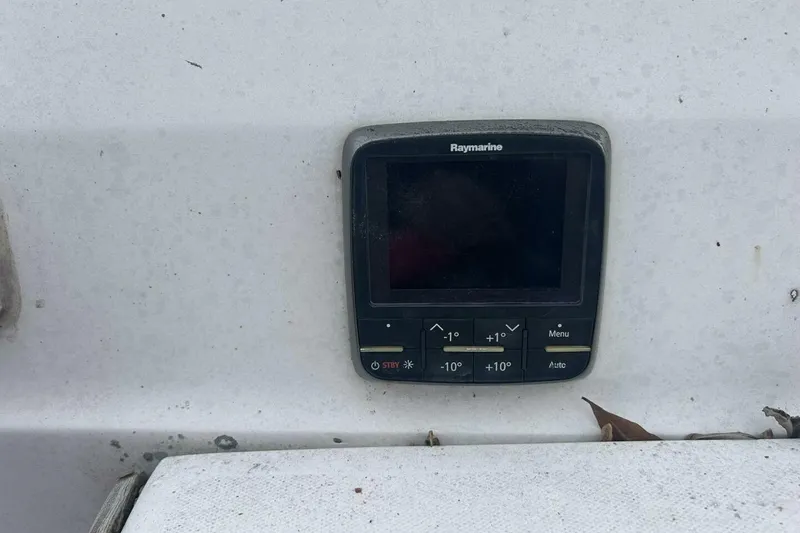 Slide: The Image of Raymarine control panel on 1985 Catalina 36 sailboat, mounted on white surface. - 54