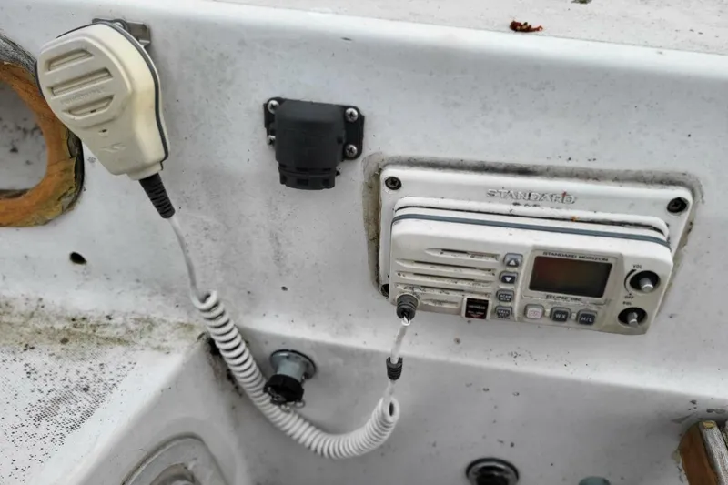 Slide: The Image of VHF radio and microphone on 1985 Catalina 36 sailboat cockpit panel. - 56