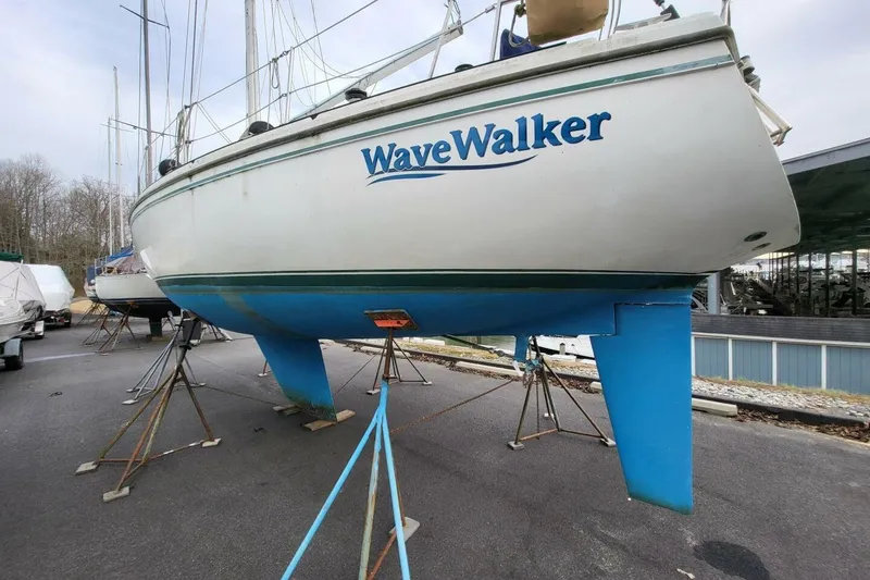 Slide: The Image of Catalina 36 sailboat "WaveWalker" from 1985 on stands in a boatyard. - 65