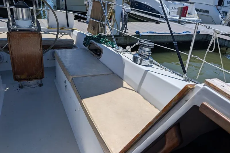 Slide: The Image of Cockpit of a 1985 Catalina 36 sailboat docked at a marina. - 79