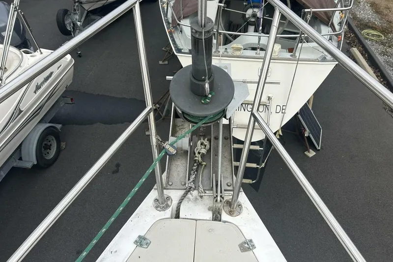 Slide: The Image of Bow view of a 1985 Catalina 36 sailboat in a marina setting. - 8